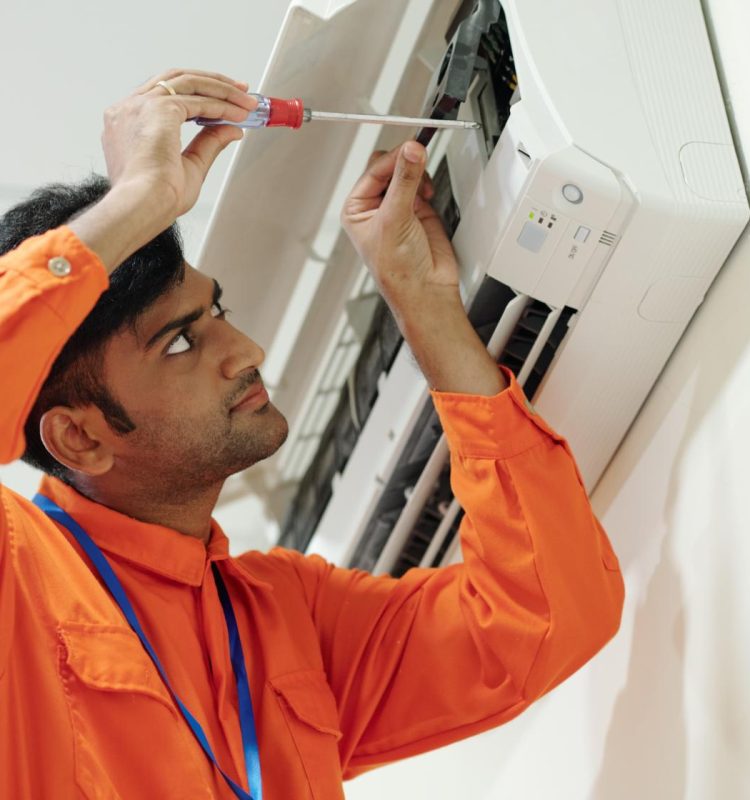 indian-man-setting-up-air-conditioner-2025-01-29-08-02-52-utc